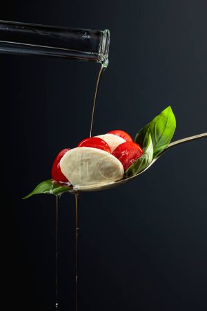 Photo for Mozzarella with tomato, basil and olive oil on a dark background. Copy space. - Royalty Free Image