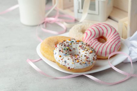 Photo for Sweet delicious tasty donuts on a white plate. - Royalty Free Image