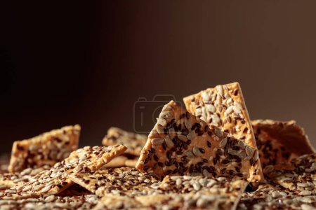 Photo for Crispy crackers with sunflower and flax seeds. Copy space. - Royalty Free Image