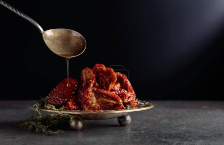 Photo for Sun-dried tomatoes with thyme in olive oil. Copy space. - Royalty Free Image