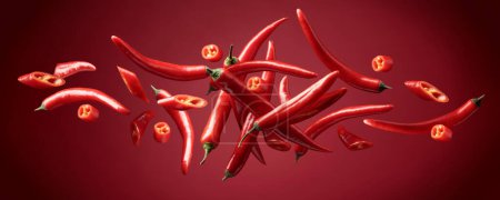 Photo for Red chili peppers in movement on a red background. - Royalty Free Image