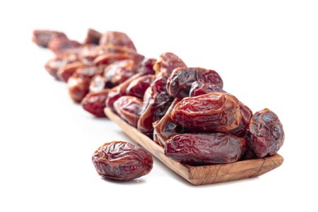 Photo for Arabic dates in a wooden dish isolated on a white background. - Royalty Free Image