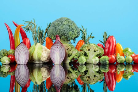 Téléchargez les photos : Composition of various raw vegetables. A conceptual image on the topic of vegetarianism. - en image libre de droit