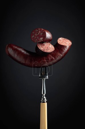 Photo for Black pudding or blood sausages on a black background. - Royalty Free Image