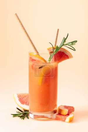 Photo for Summer cocktail with grapefruit, rosemary, and ice in a frozen glass. - Royalty Free Image