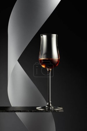 Photo for Snifter of brandy on a black background. - Royalty Free Image