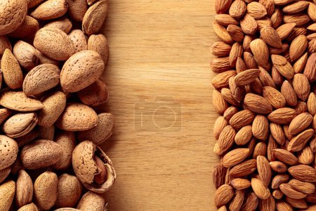 Photo for Almonds on a wooden background. Top view with copy space. - Royalty Free Image