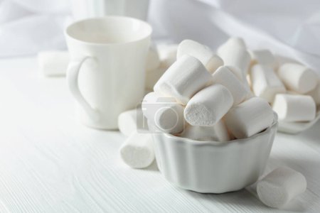 Photo for White marshmallows on a white wooden table. - Royalty Free Image