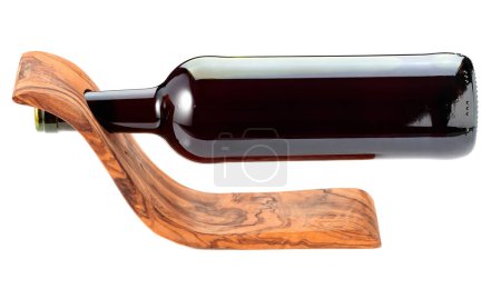 Photo for Bottle of red wine in a wooden bottle holder is isolated on a white background. - Royalty Free Image