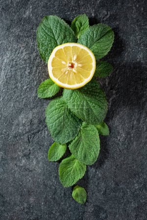 Photo for Lemon slice and mint leaves, top view. - Royalty Free Image