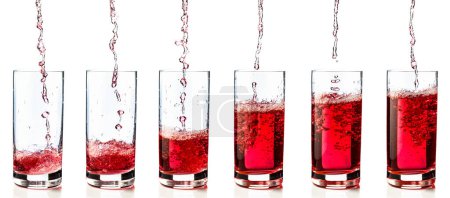 Photo for Pouring pink drink or juice into a glass. Isolated on a white background. - Royalty Free Image