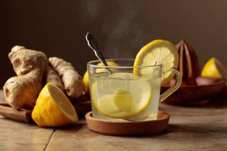 Photo for Ginger tea with lemon on a kitchen table. - Royalty Free Image