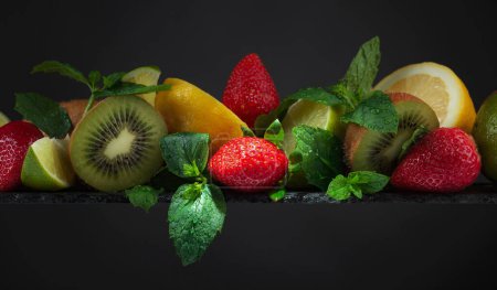 Photo for Fresh fruits and berries on a black background. Copy space. - Royalty Free Image