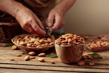Photo for Almond nuts on an old wooden table. Copy space. - Royalty Free Image