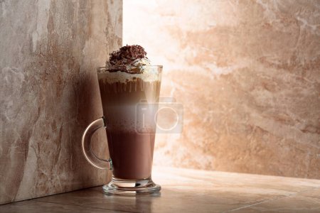Photo for Milk coffee cocktail with whipped cream sprinkled with chocolate crumbs. Copy space. - Royalty Free Image
