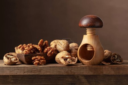 Photo for Walnuts on an old wooden table. Frontal view. - Royalty Free Image