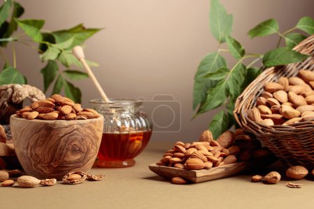 Photo for Almond nuts and honey on a brown background. Copy space. - Royalty Free Image