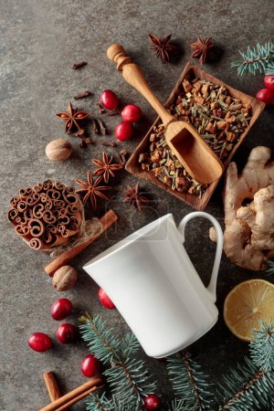 Photo for White mug and ingredients for making a winter hot drink on vintage background. Top view. - Royalty Free Image