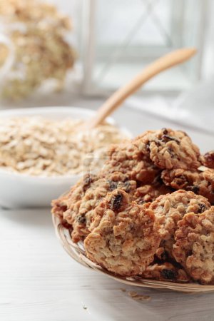 Photo for Oatmeal raisin cookies on a white table. - Royalty Free Image