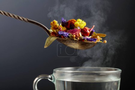 Photo for Mix of various dried medicinal plants and herbs for herbal tea on a black background. - Royalty Free Image