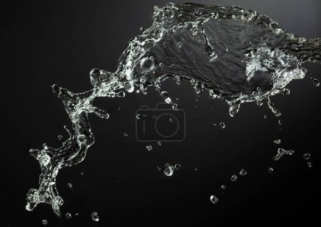 Foto de Salpicadura de agua en el fondo negro. Copiar espacio. - Imagen libre de derechos
