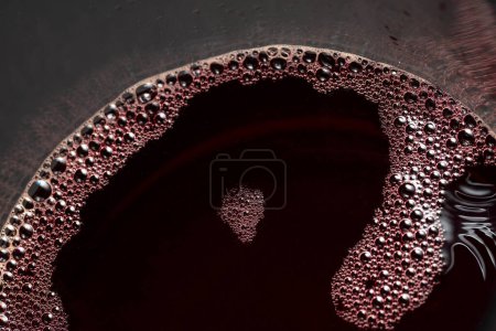 Photo for Red wine in glass. Macro shot with selective focus. Copy space. - Royalty Free Image