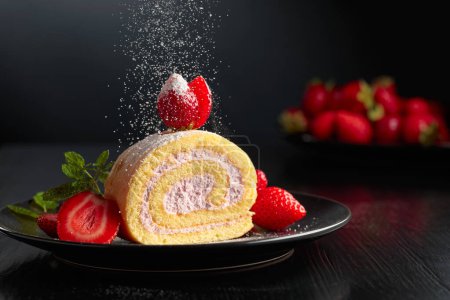 Photo for Homemade strawberry biscuit cake roll with cream cheese, whipped cream, and fresh berries. Delicious biscuit cake sprinkled with sugar powder. - Royalty Free Image