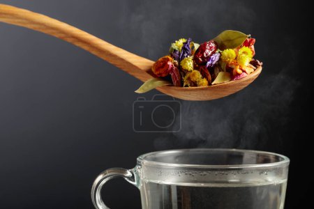 Photo for Mix of various dried medicinal plants and herbs for herbal tea on a black background. - Royalty Free Image