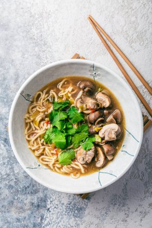 Photo for Asian vegan miso ramen noodle soup with mushrooms, onions and cilantro - Royalty Free Image
