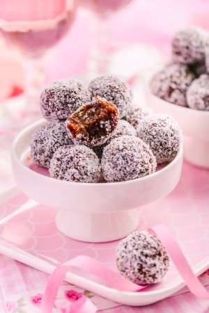 Photo for Energy protein balls with healthy ingredients, made with dates, peanut butter, flax and chia seeds, oats, almond and chocolate drops - Royalty Free Image