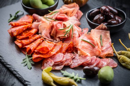 Photo for Charcuterie board with prosciutto ham, salami, olives and tapas - Royalty Free Image