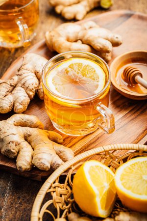 Photo for Ginger tea with lemon and honey on a wooden table - Royalty Free Image