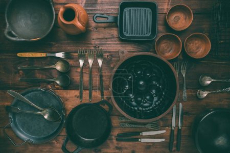Foto de Kitchen utensils, cooking tools, on wooden background. Vintage kitchenware collection. - Imagen libre de derechos