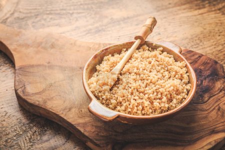 Photo for Healthy colorful cooked quinoa. Superfood, gluten-free food on wooden background. - Royalty Free Image
