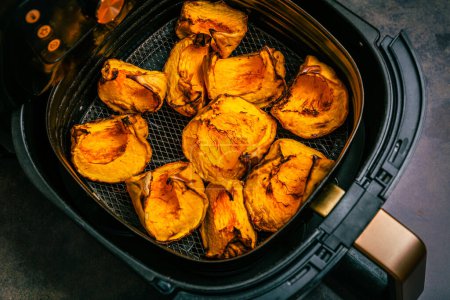 Baking and roasting pumpkin pieces in airfryer, preparing pumpkin puree or mash.