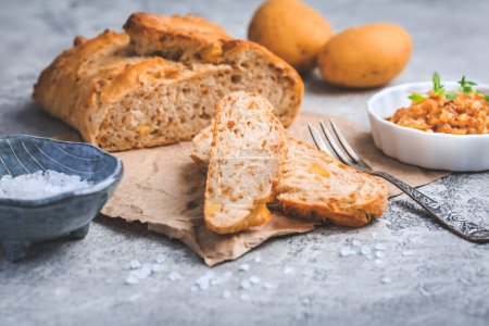 Photo for Homemade oven baked bread with carrots and onions on wooden tabl - Royalty Free Image