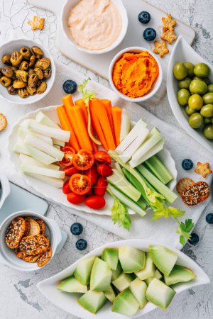 Photo for Crudites platter, raw vegetarian food or party vegetarian platter with various veggie snacks and dips - Royalty Free Image