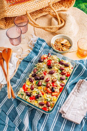 Photo for Picnic time - homemade orzo pasta salad with feta, olives, tomatoes - Royalty Free Image