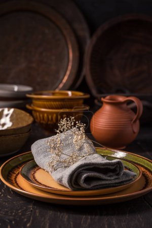 Photo for Set of kitchen ceramic and wooden tableware a table. Eco style home still life.  Vintage style - Royalty Free Image