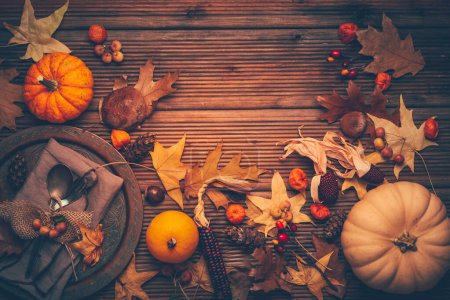 Photo for Autumn and Thanksgiving background with pumpkins and autumn leaves, place setting. - Royalty Free Image