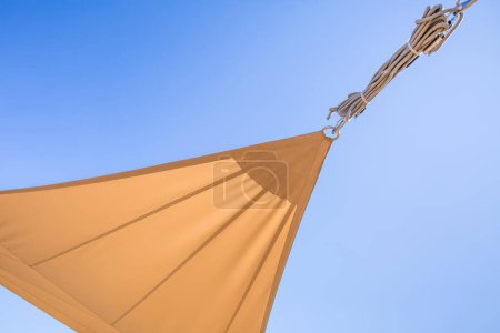 Photo for Detail of  sun shade sail or awnings against sunny blue sky for balcony or patio - Royalty Free Image