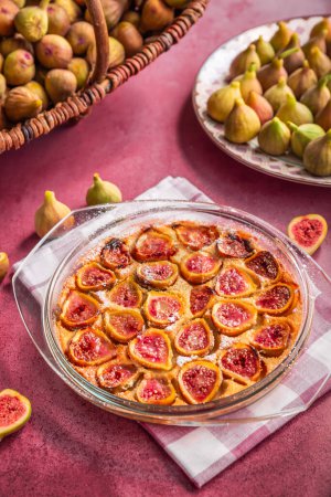 Photo for French fig clafoutis with almonds in baking form, glutenfree dessert - Royalty Free Image