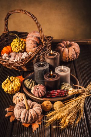 Photo for Pumpkins on wooden table - Thanksgiving, fall themed holiday table setting arrangement for a seasonal party - Royalty Free Image