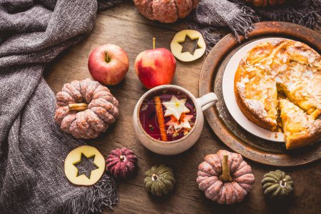 Photo for Herbal tea with fruits and cinnamon with apple pie for Thanksgiving. - Royalty Free Image