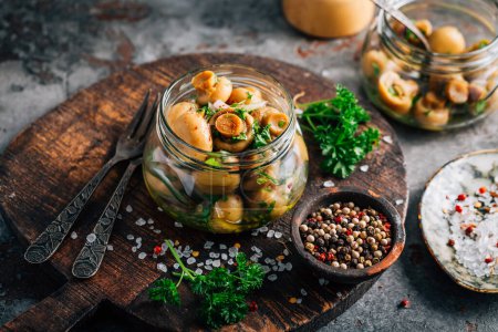 Photo for Homemade pickled mushrooms in a jar with spices - Royalty Free Image