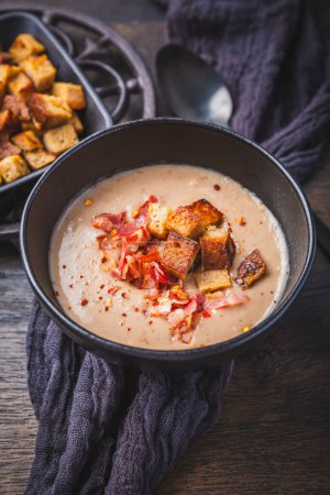Photo for Homemade sweet chestnut soup with bacon and bread croutons - Royalty Free Image