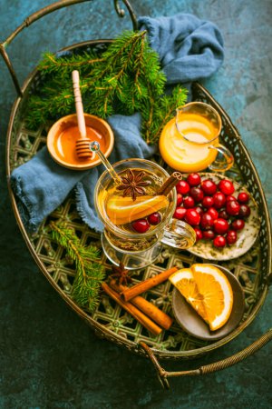 Photo for Delicious white mulled wine with orange, honey, cranberries and spices - Royalty Free Image