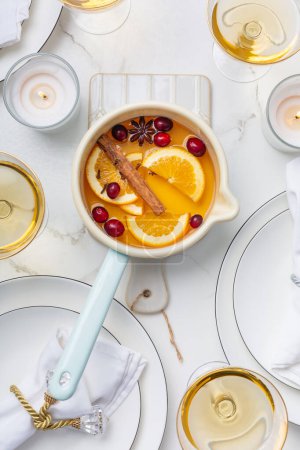 Photo for Delicious white mulled wine with honey, cranberries and spices - Royalty Free Image