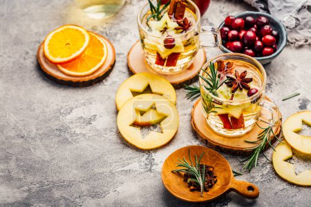 Photo for Delicious white mulled wine with apples, cranberries and spices - Royalty Free Image