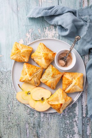 Photo for Homemade apple turnovers - puff pastry with apple and cinnamon filling - Royalty Free Image